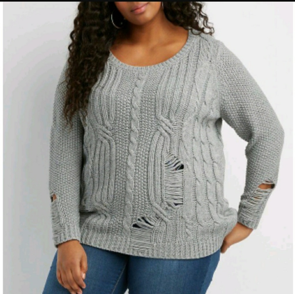 Distressed cable knit sweater